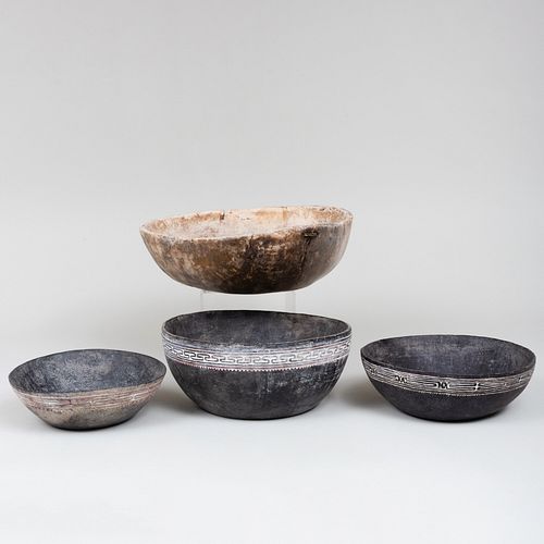THREE BLACK PAINTED WOODEN BOWLS