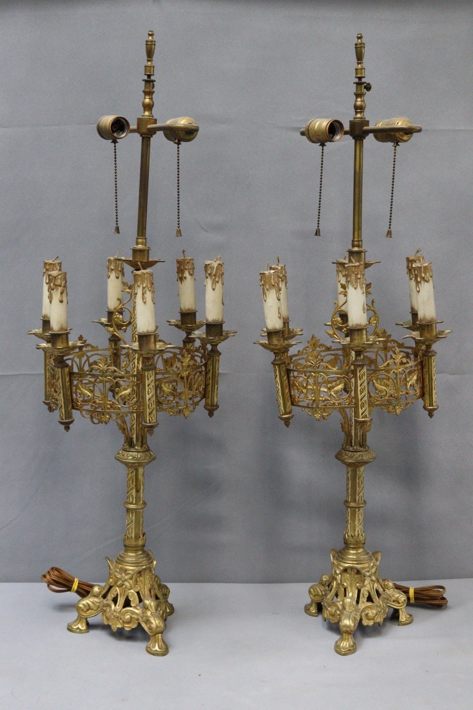 A PAIR OF GOTHIC STYLE BRASS CANDELABRA 3b7693