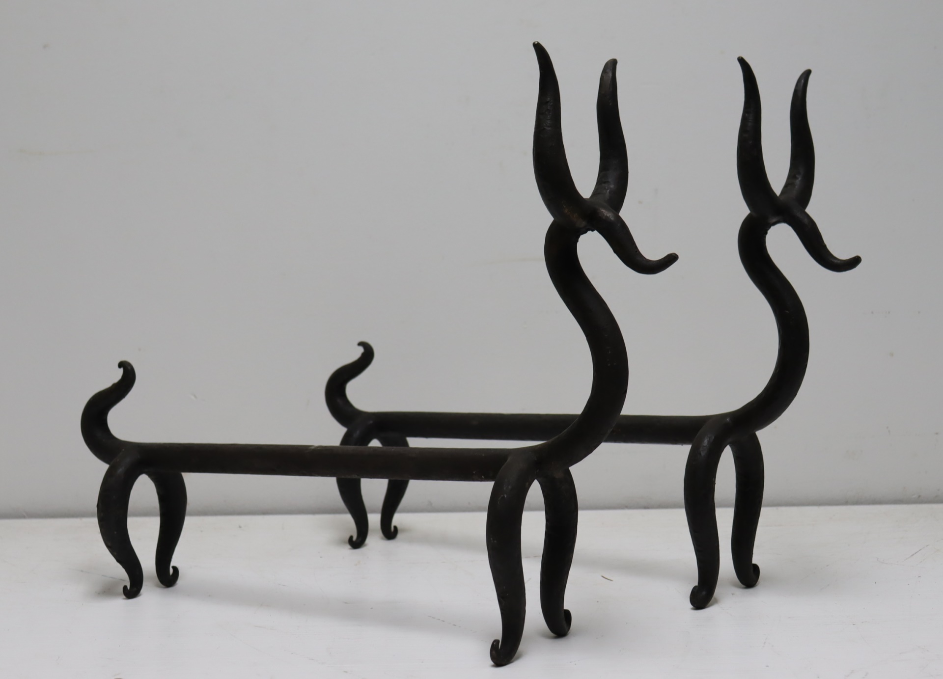 A PAIR OF WROUGHT IRON DOG FORM 3b7ab0