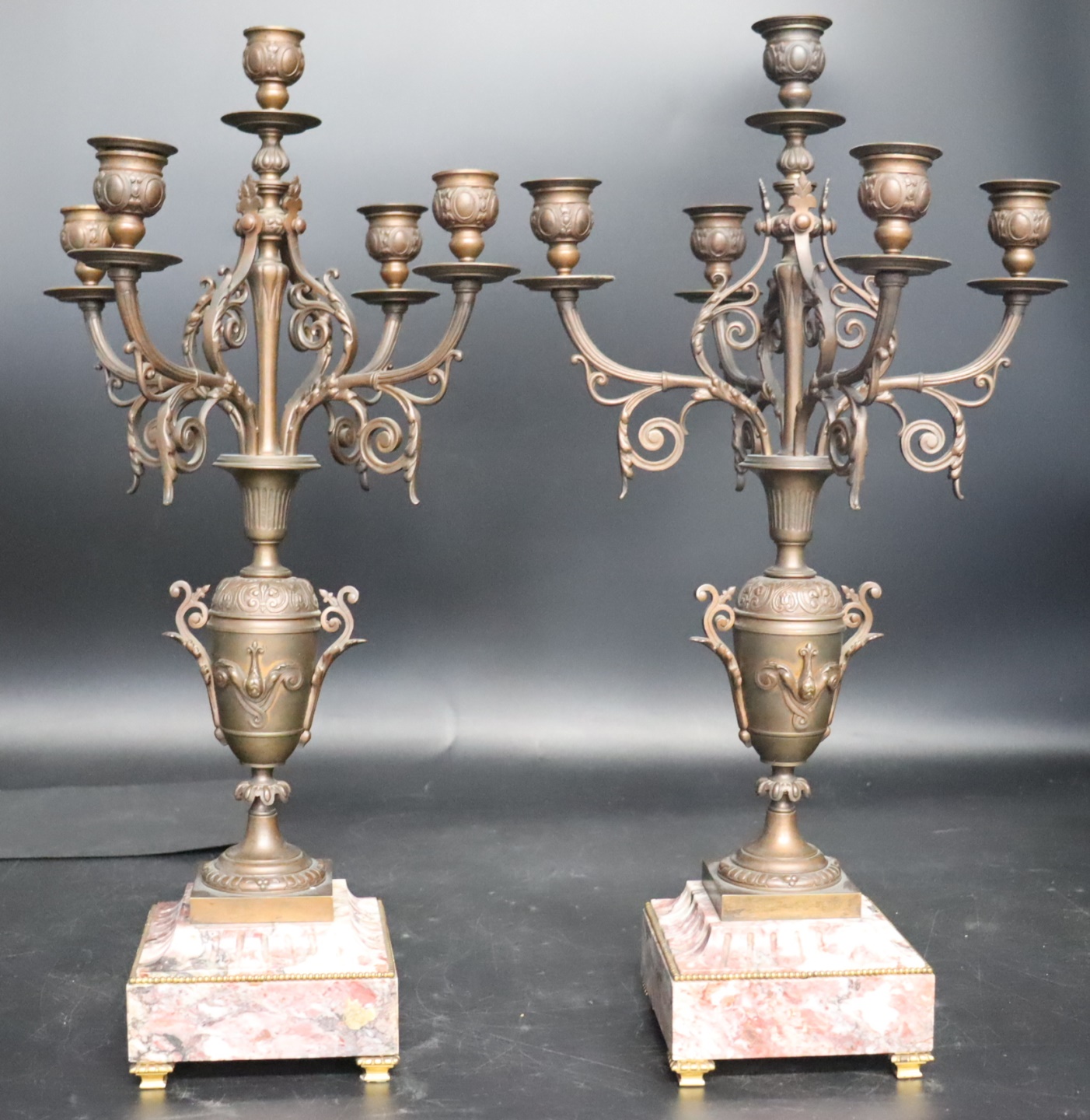 AN ANTIQUE PAIR OF BRONZE CANDELABRA  3b7ab9