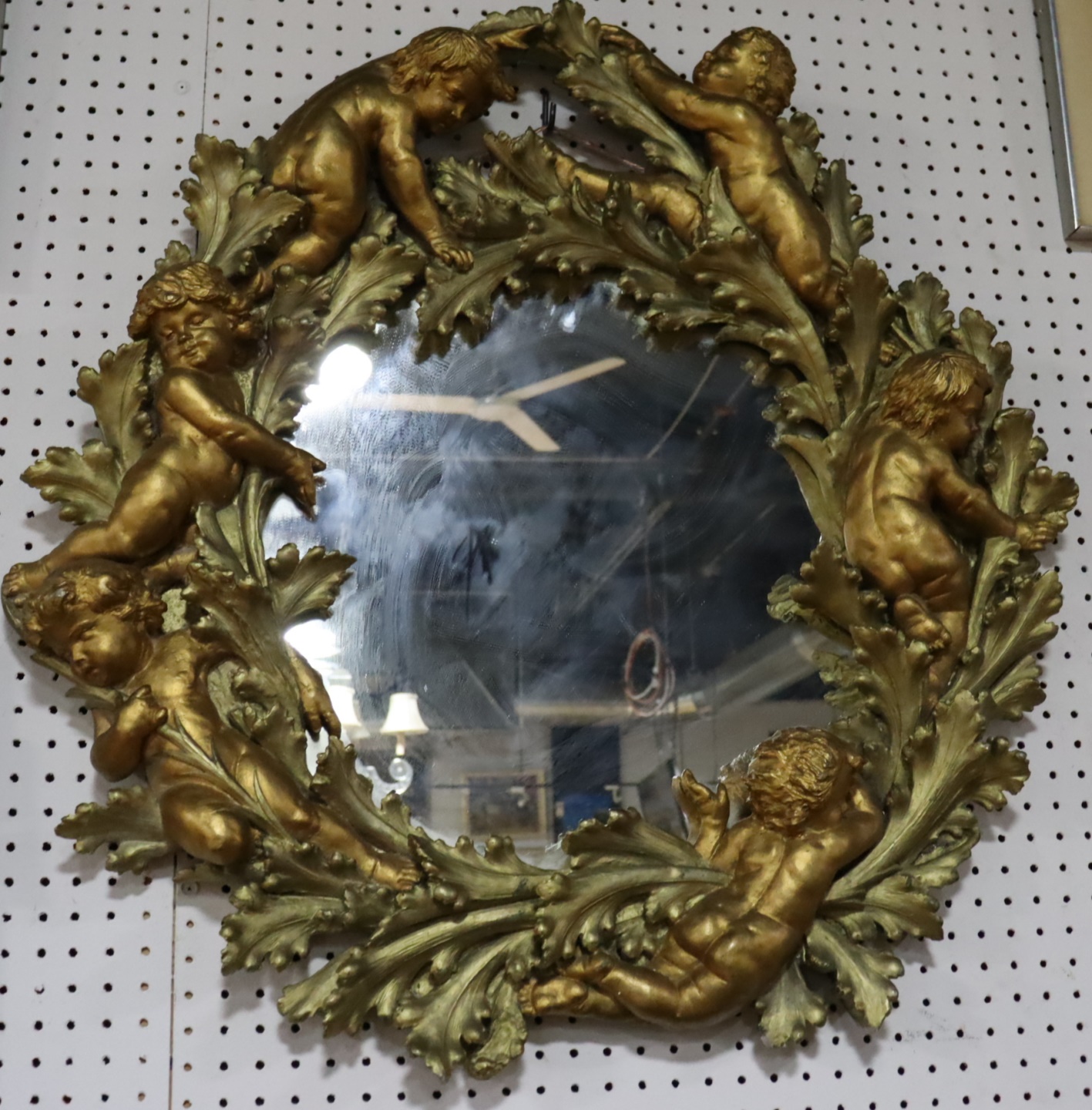 A GILDED COMPOSITION MIRROR FRAMED 3b7ad1