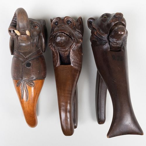 THREE CARVED AND STAINED WOOD ANIMAL