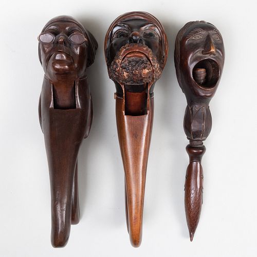 THREE STAINED AND CARVED WOOD FIGURAL