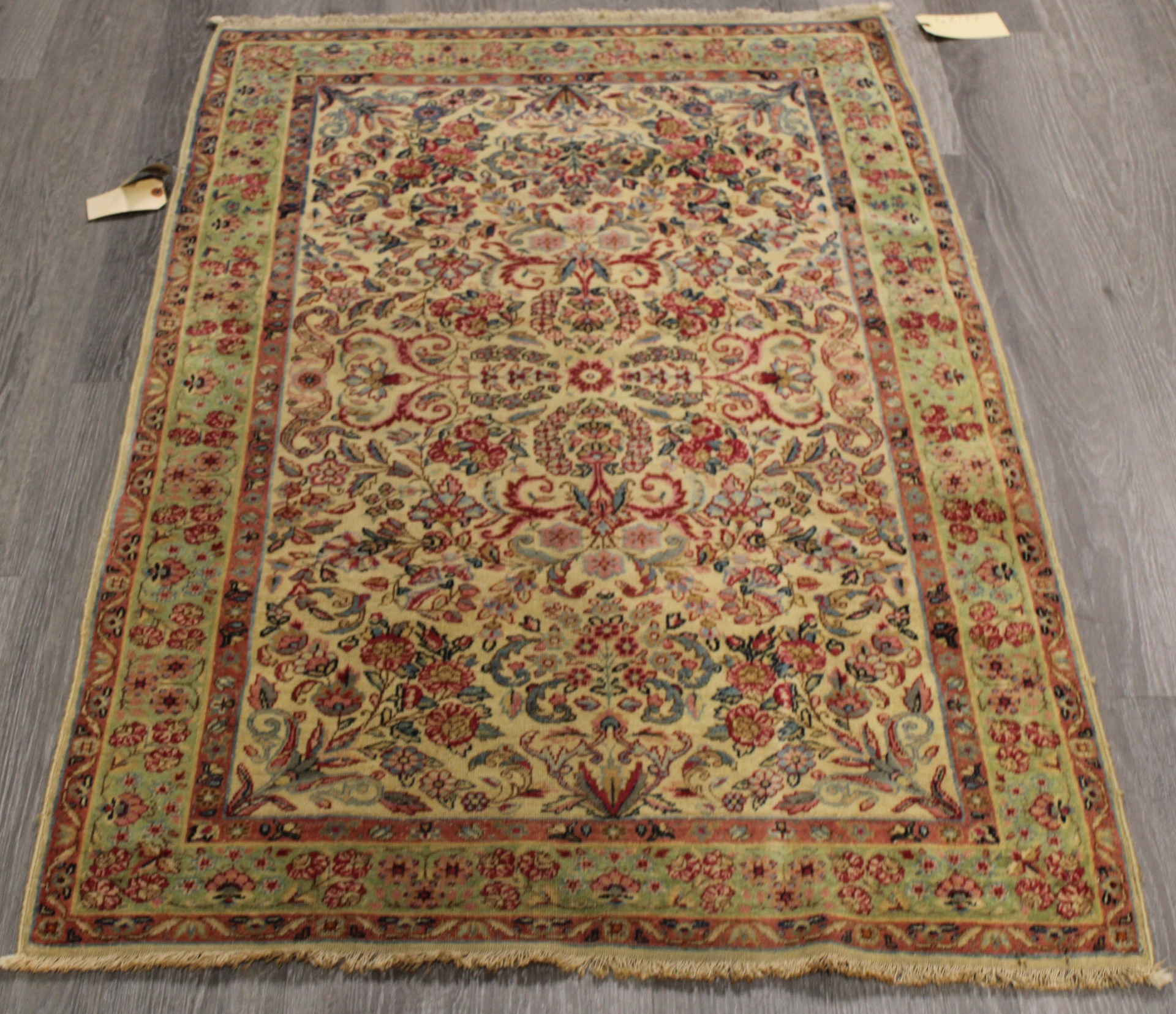 ANTIQUE AND FINELY HAND WOVEN CARPET.