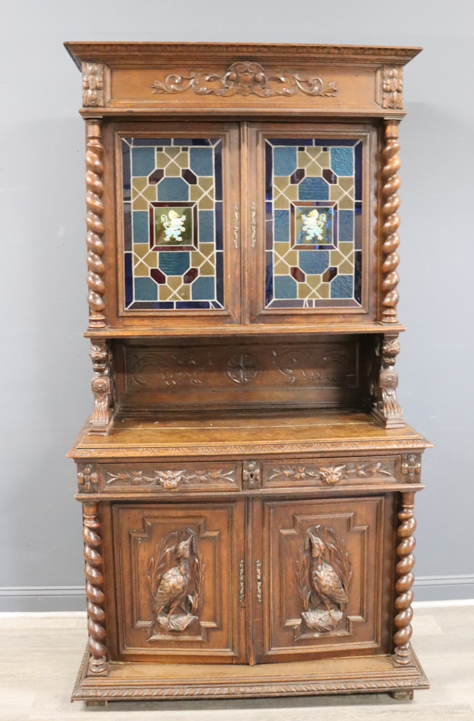 ANTIQUE CARVED STEP BACK CABINET