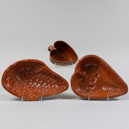 THREE FRENCH REDWARE POTTERY MOLDSComprising A 3b804b