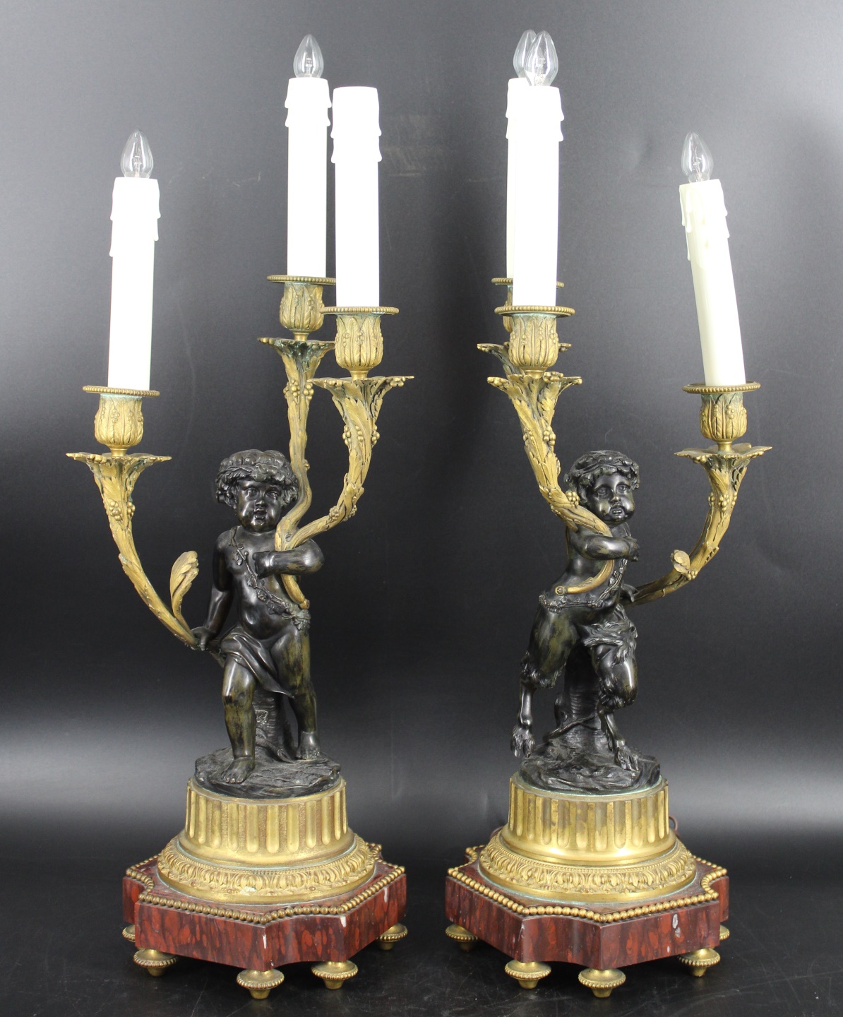 A PAIR OF ANTIQUE 3 LIGHT PUTTI 3b8128