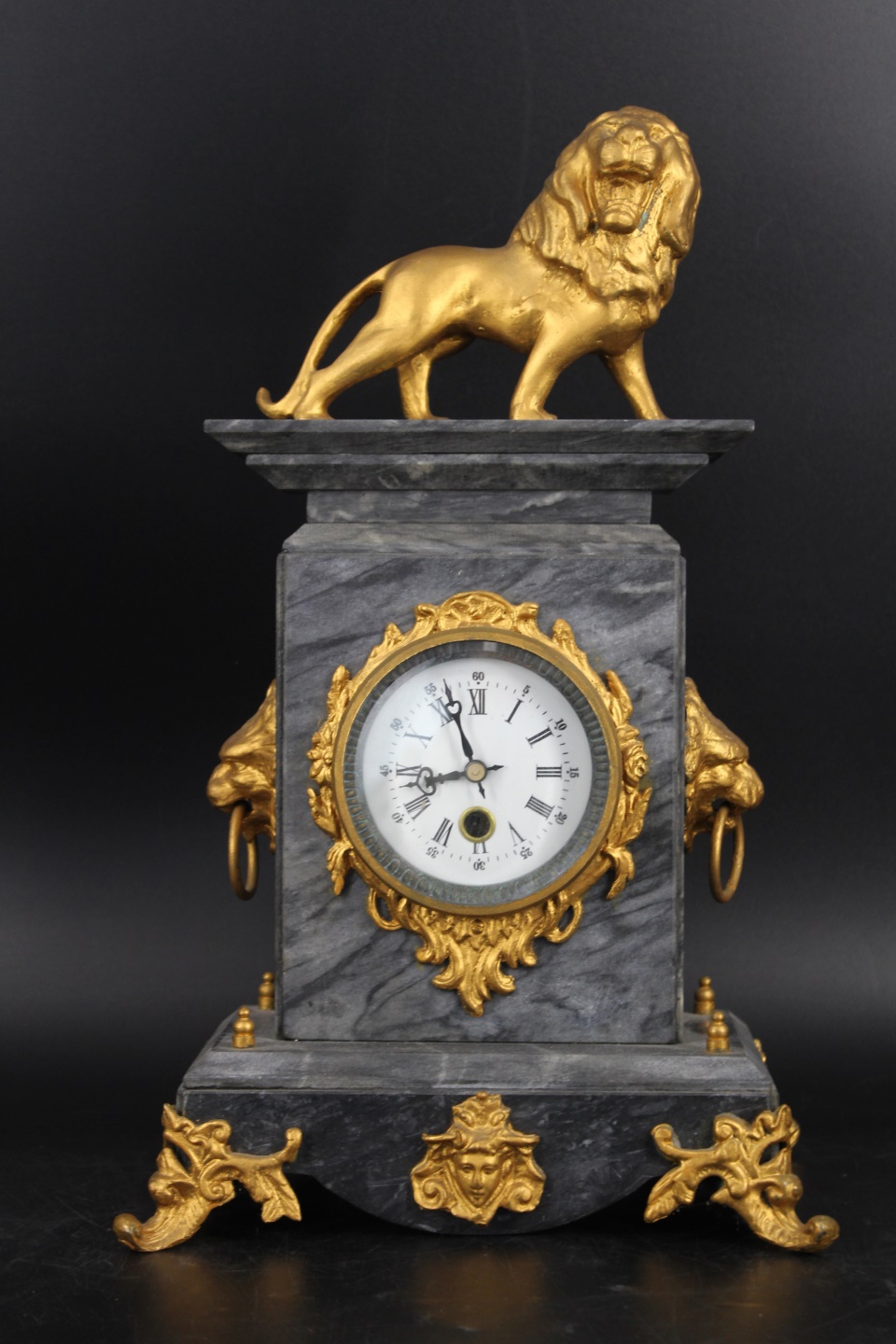 A GILT METAL MOUNTED MARBLE CLOCK