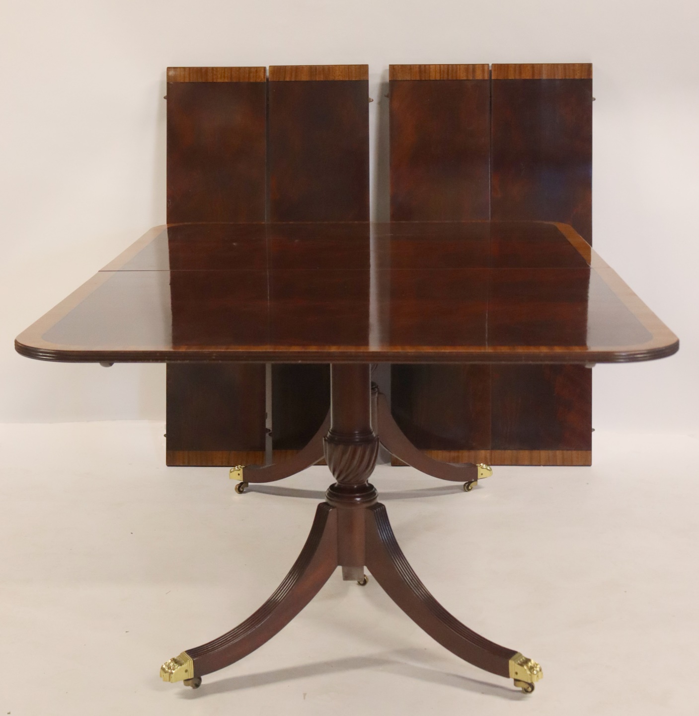 KITTINGER SIGNED BANDED MAHOGANY TABLE.