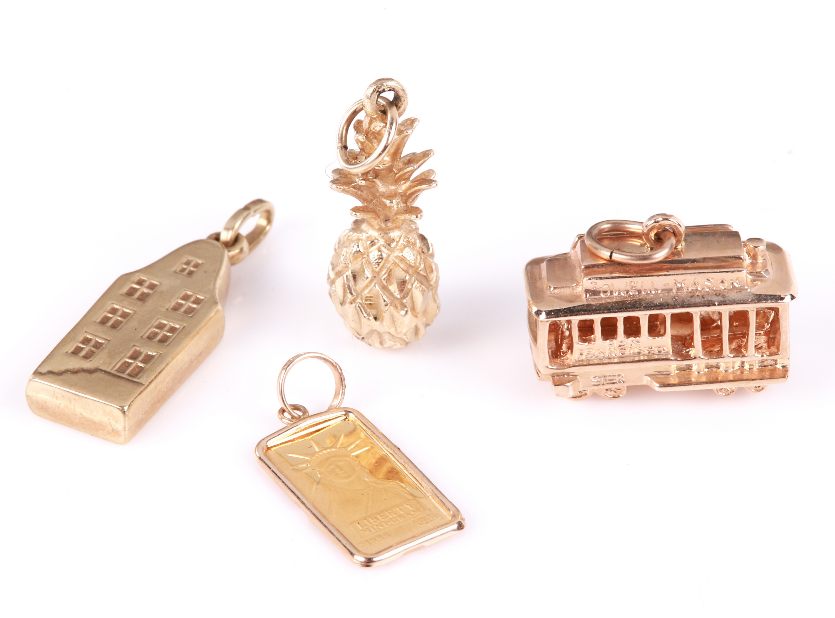  4 Yellow gold charms to include 3b5b5b
