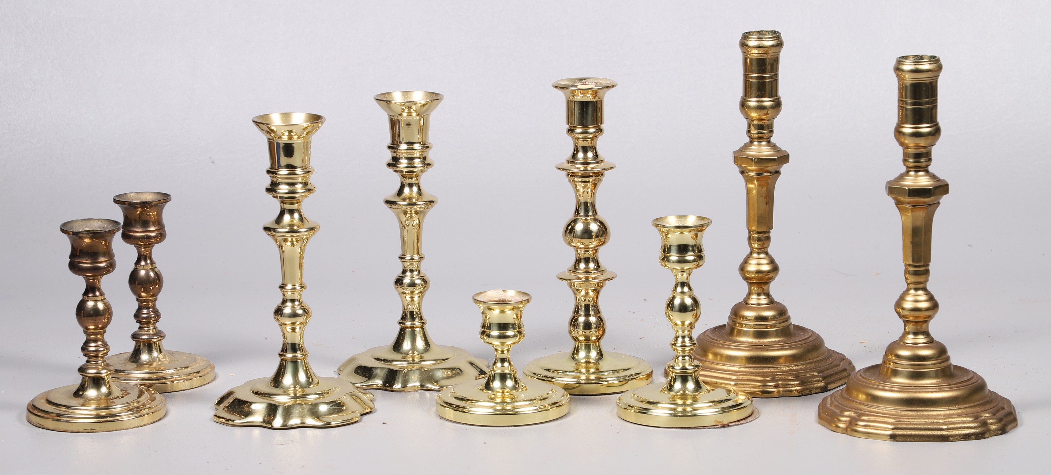 (9) Brass candlesticks, c/o pair Baldwin
