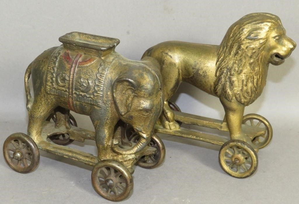 CAST IRON ELEPHANT & LION ON WHEELS