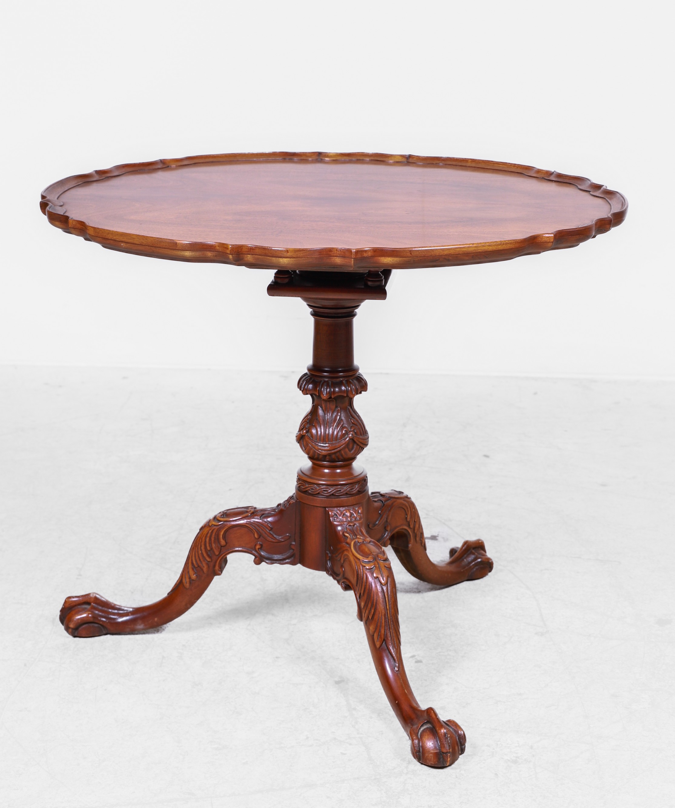 A Chippendale style carved mahogany