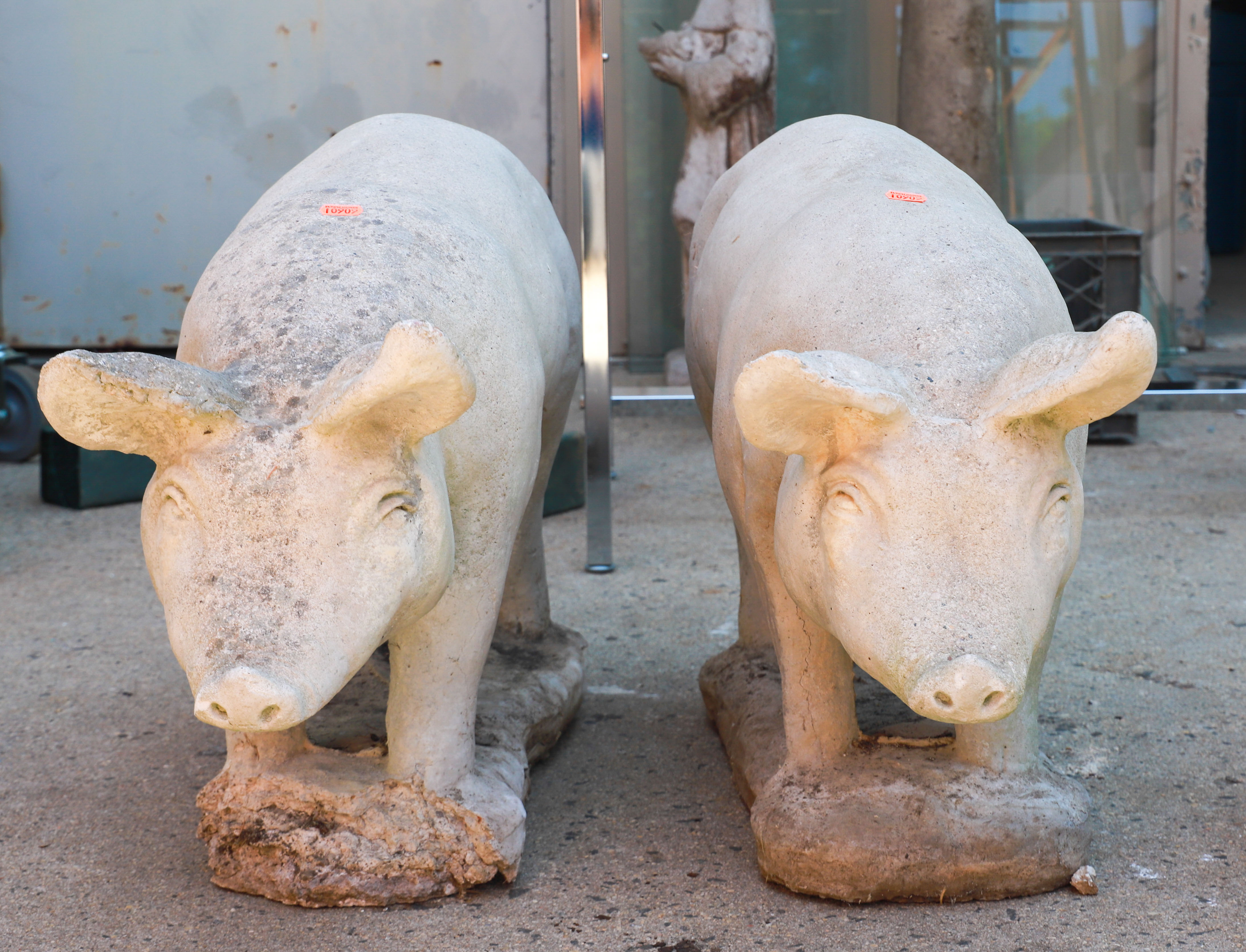 Pair Cement garden statues of pigs,