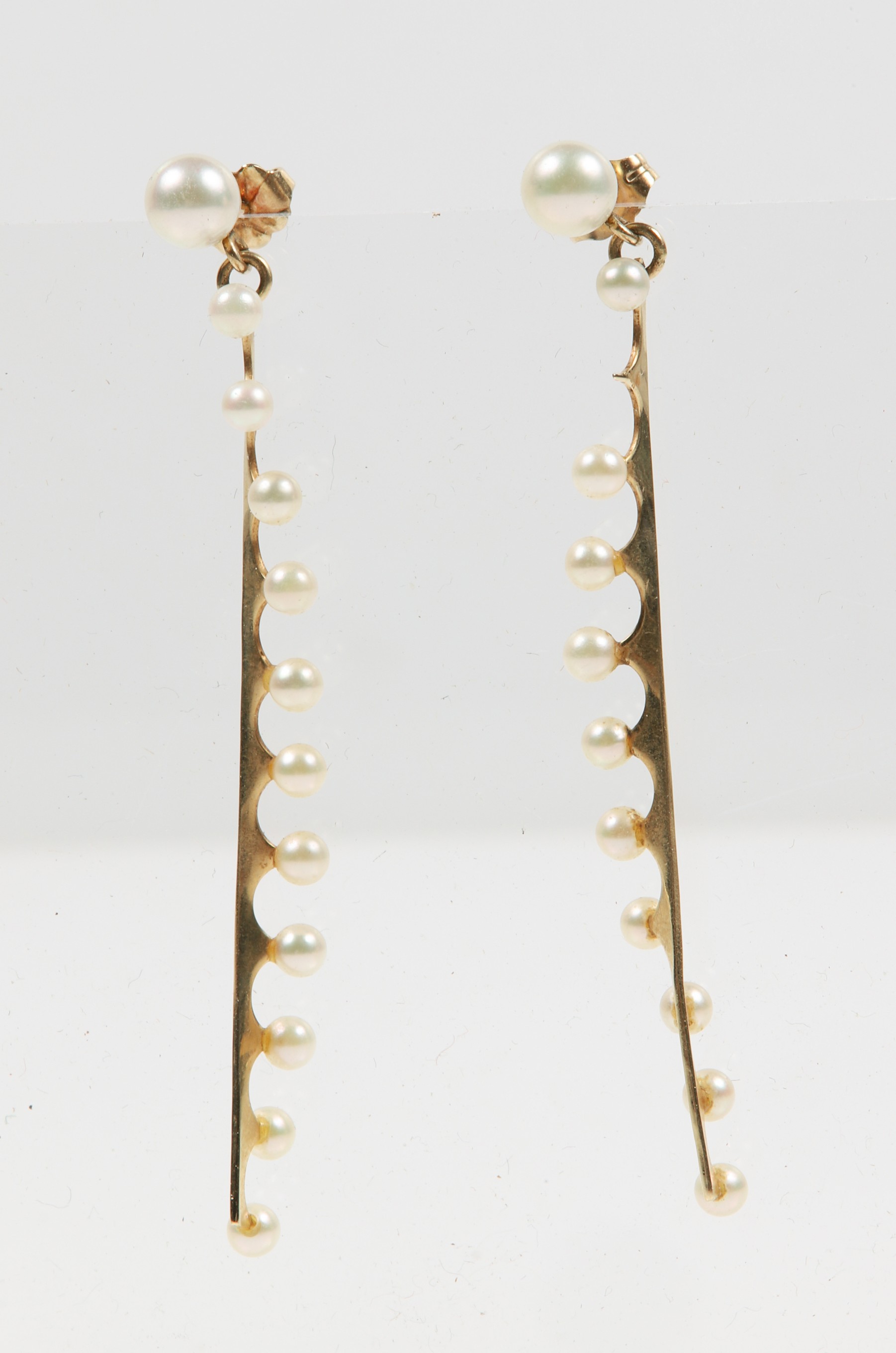 A pair of pearl drop earrings,