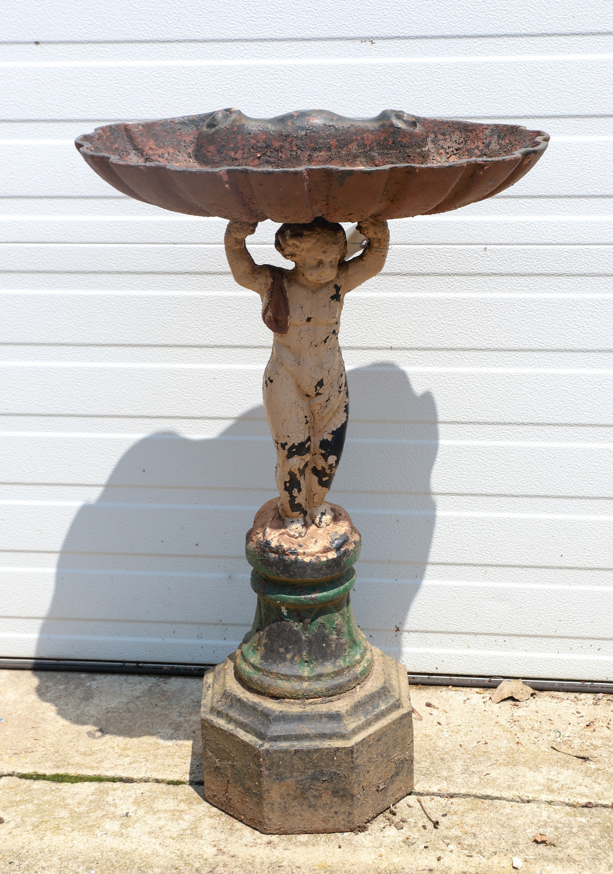 Iron birdbath w/ putti, shell dish,