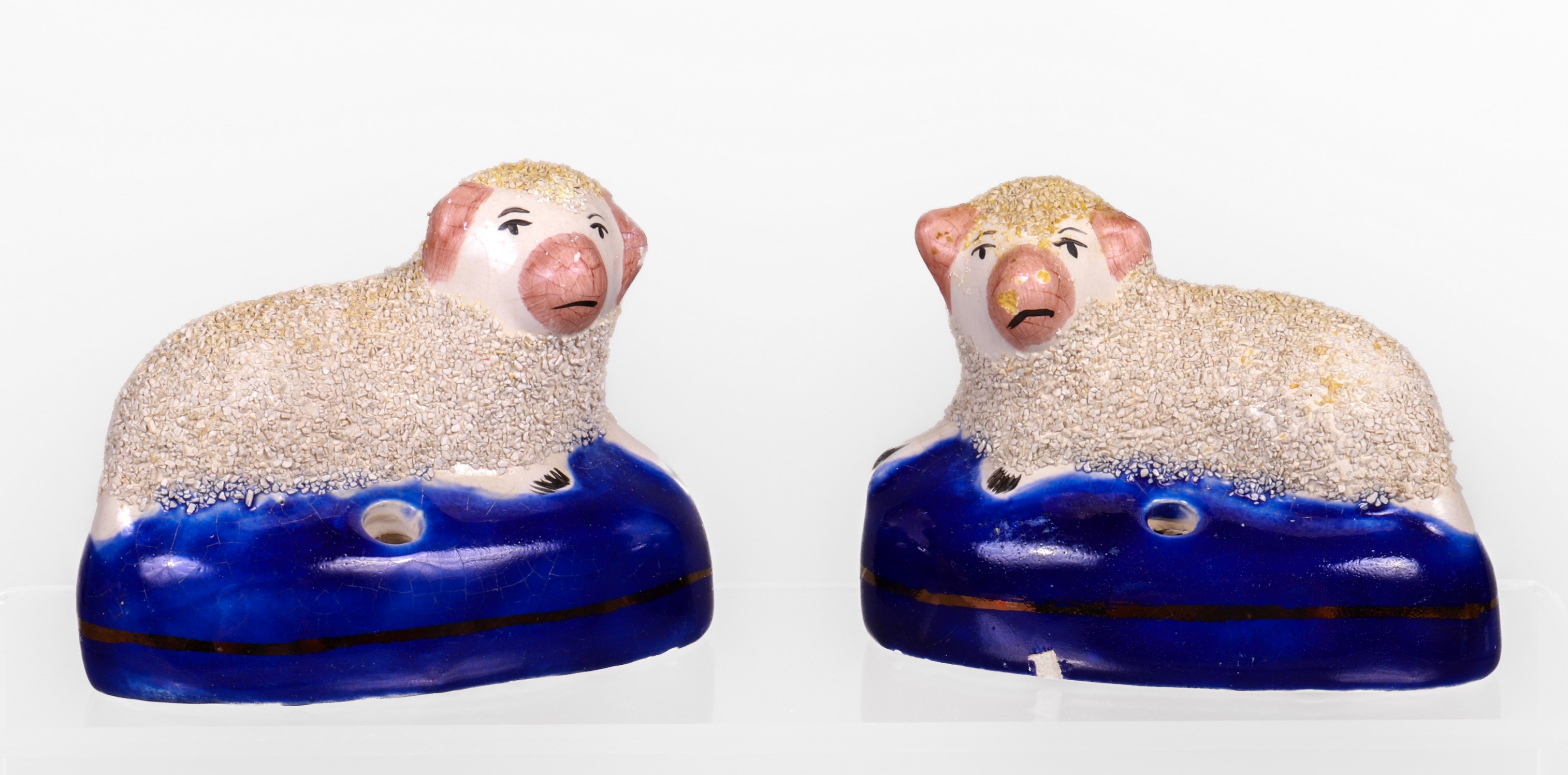 Pair of Staffordshire sheep porcelain