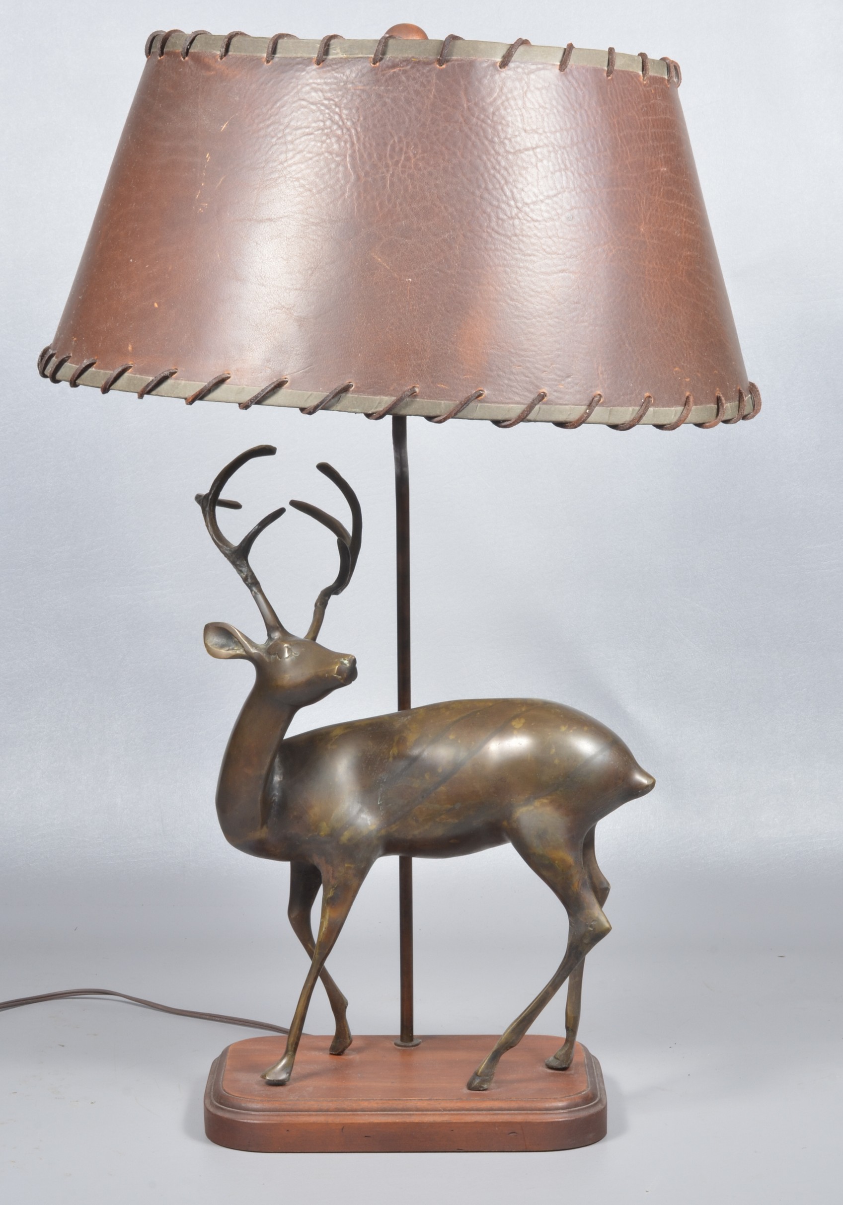 Brass stag sculpture mounted table