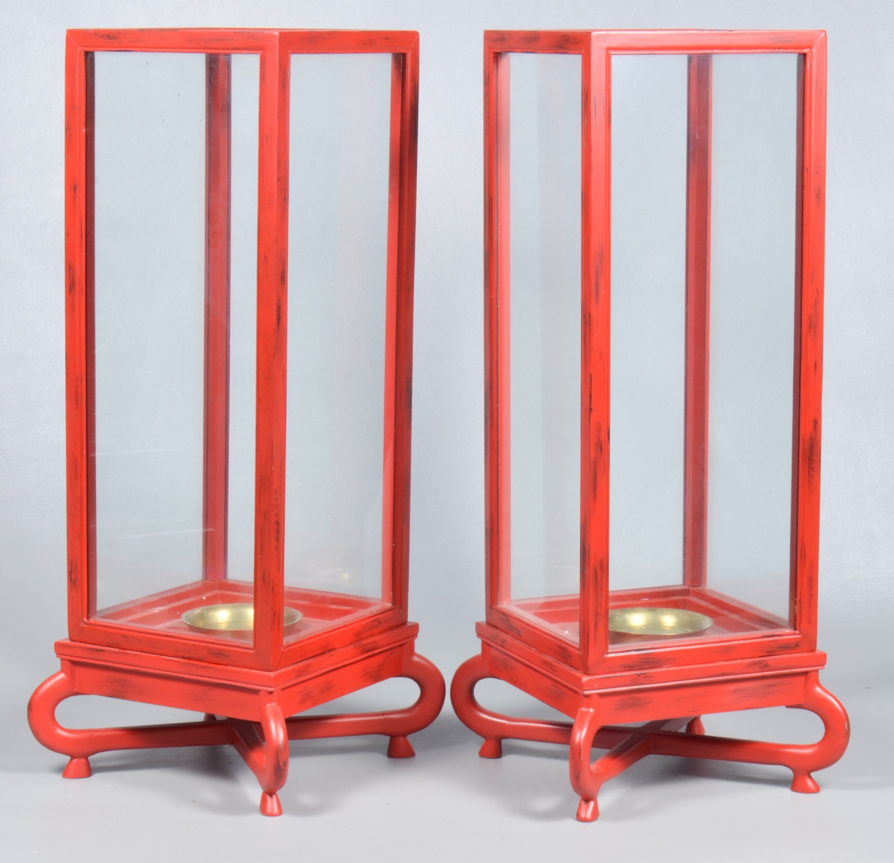 A pair of Chinese red painted candle