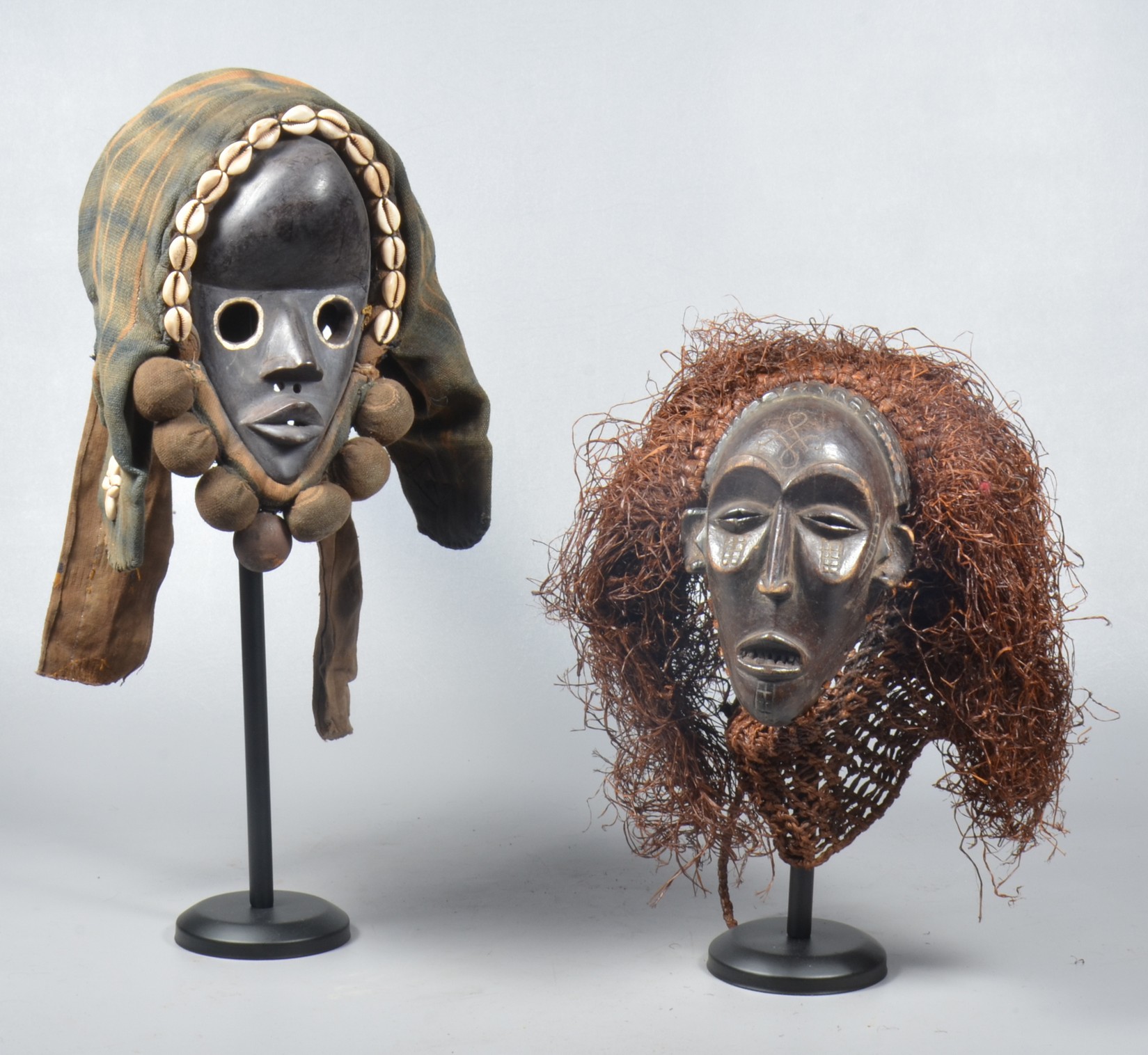 (2) Carved wood African masks,