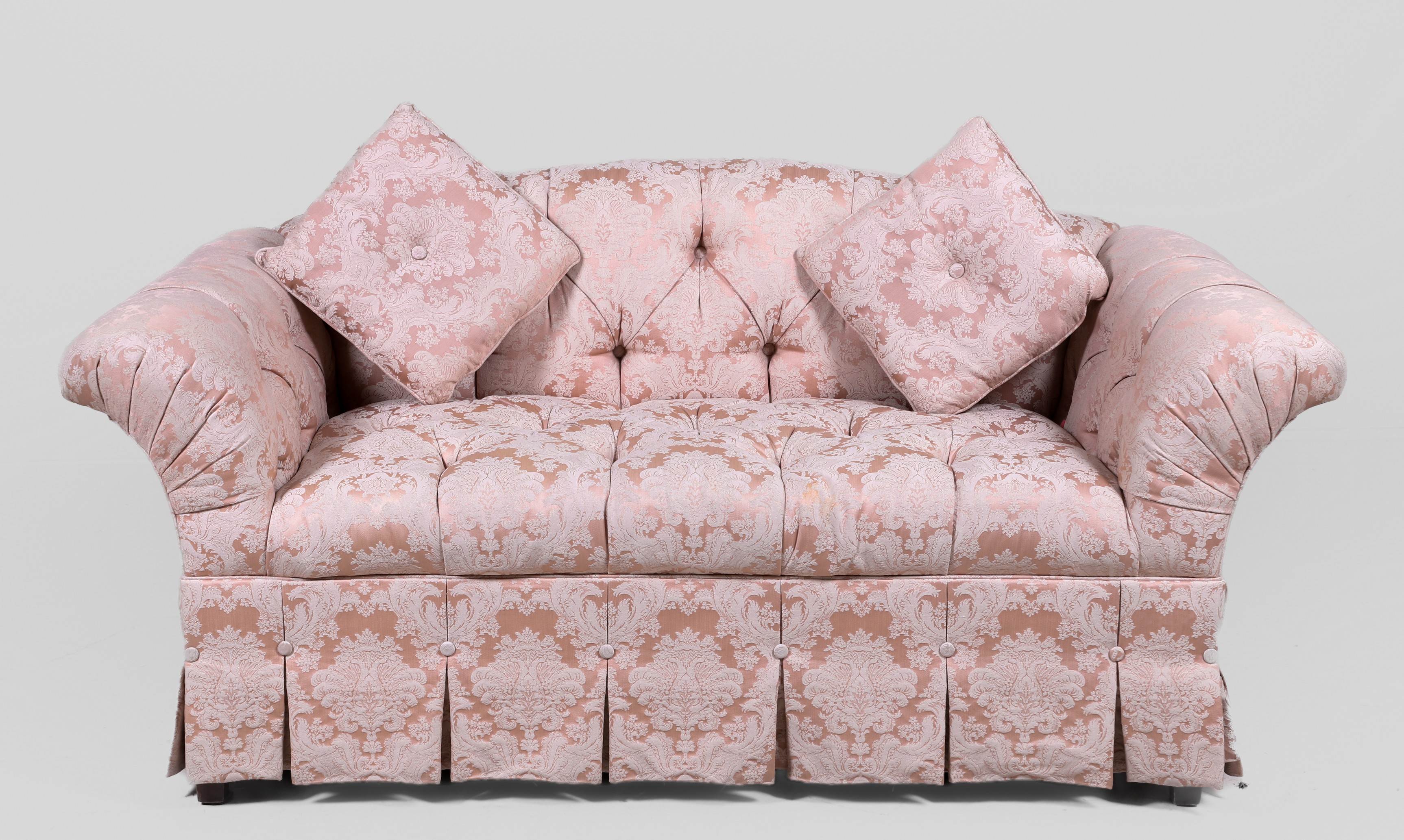 Tufted upholstered sofa, pink and cream