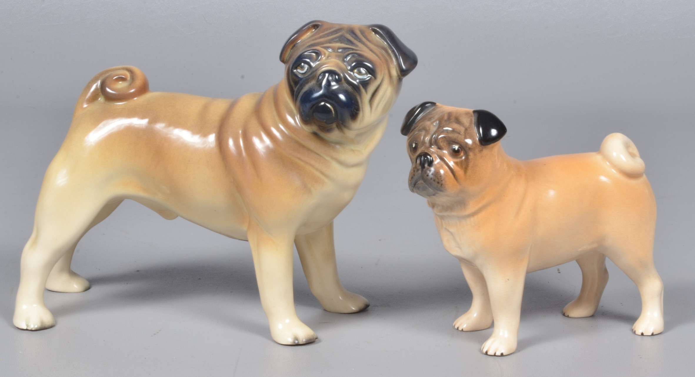 (2) Porcelain pug dog figures to