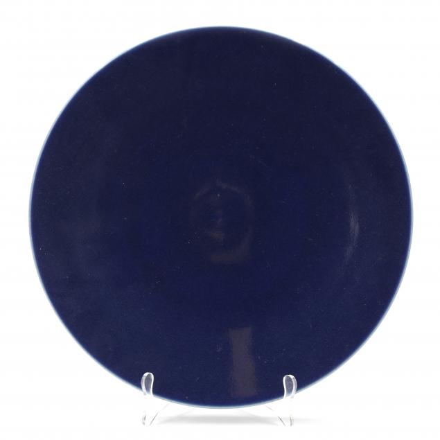 A CHINESE MONOCHROME BLUE GLAZED CHARGER