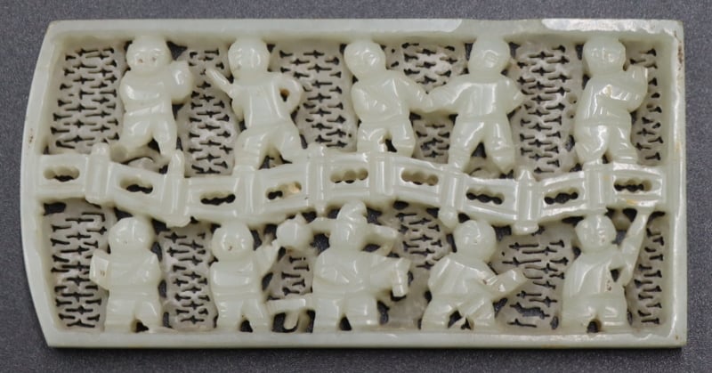 HIGHLY CARVED JADE PLAQUE OF CHILDREN.