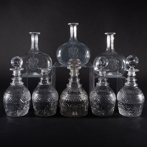 GROUP OF EIGHT CUT GLASS DECANTERS