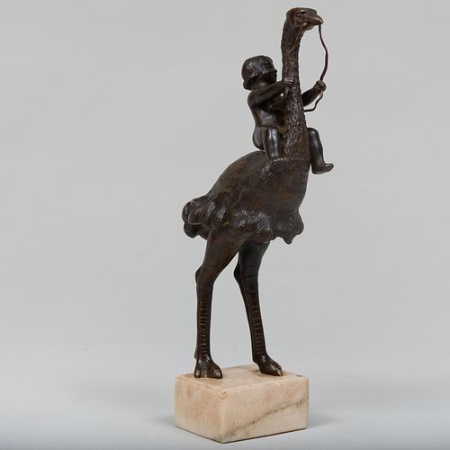 UNUSUAL BRONZE MODEL OF A BOY RIDING