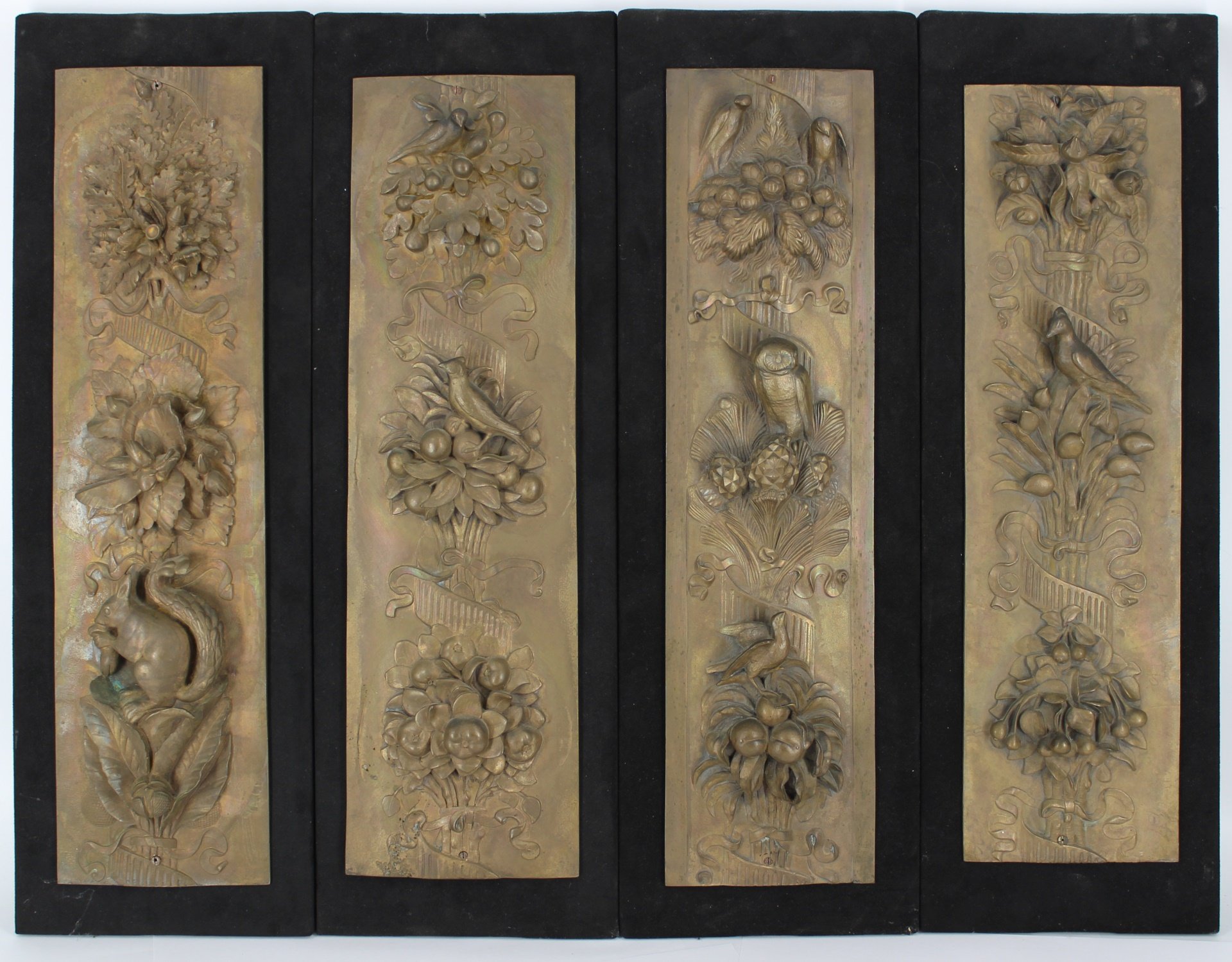 FOUR DECORATIVE BRONZE PANELS OF