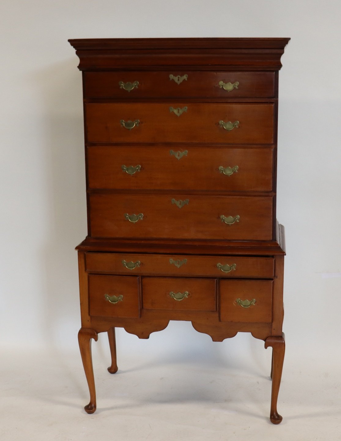 AMERICAN QUEEN ANNE CHEST ON STAND.