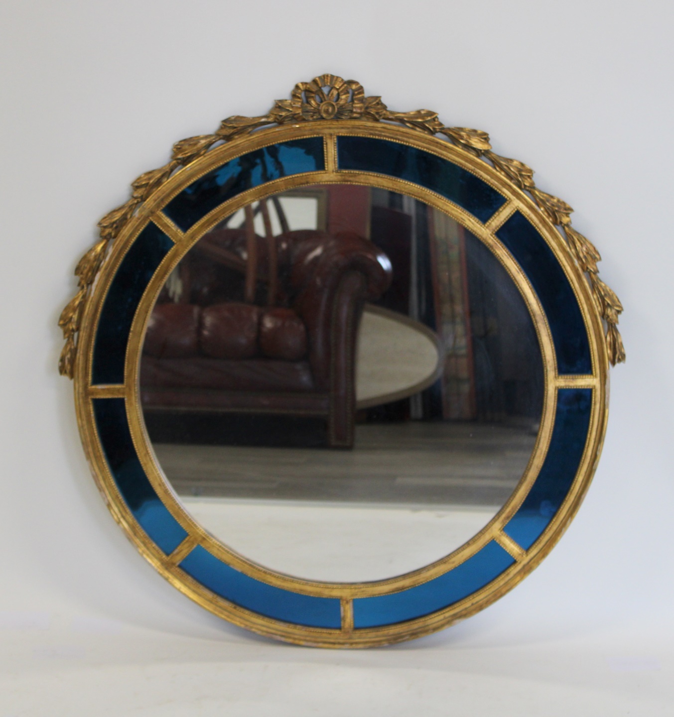 AN ART DECO CARVED & GILTWOOD MIRROR