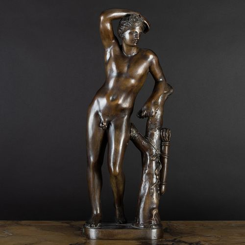 BRONZE MODEL OF A MAN LEANING ON 3b8672