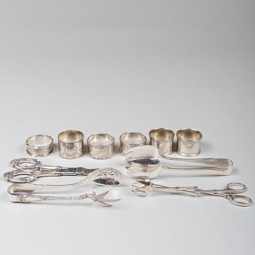 GROUP OF SILVER TONGS AND NAPKIN 3b8942
