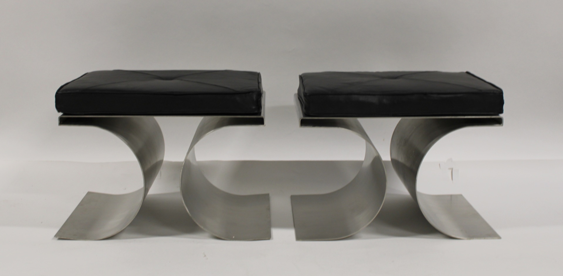 A PAIR OF POLISHED STEEL BENCHES 3b8a70