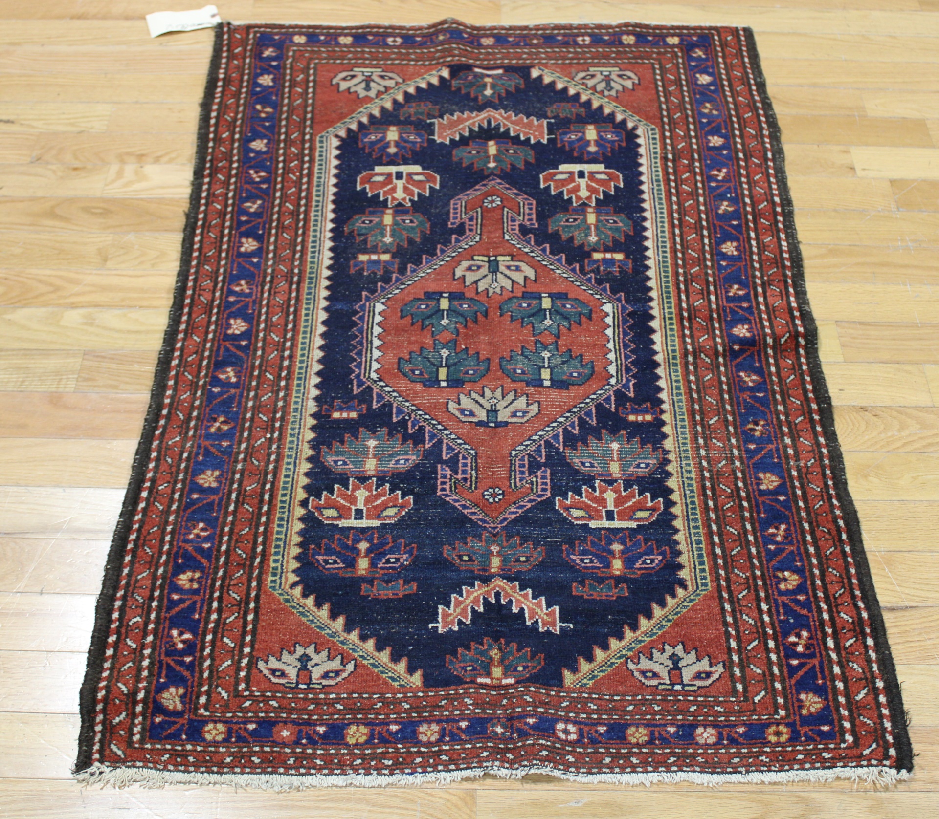 ANTIQUE AND FINELY HAND WOVEN CARPET.
