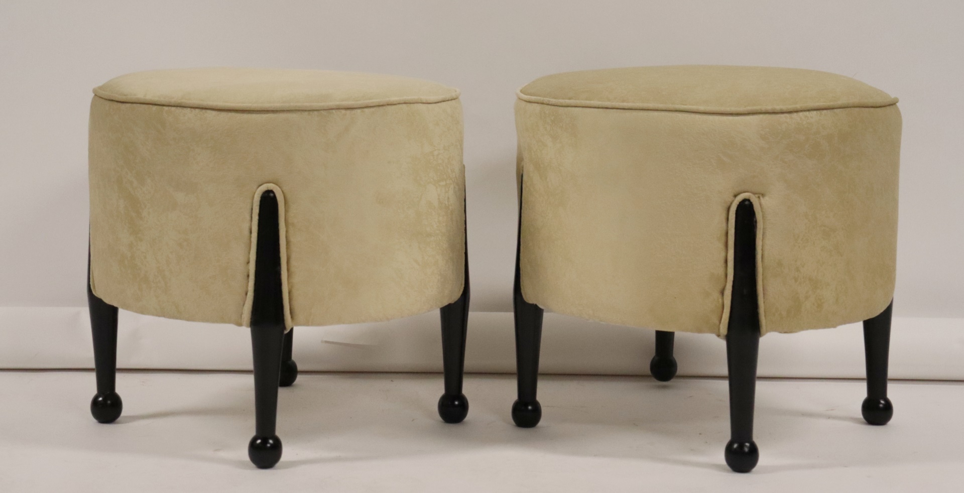 A PAIR OF POOF STYLE BENCHES WITH 3b8d6a