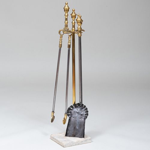 SET OF BRASS FIRE TOOLS ON MARBLE