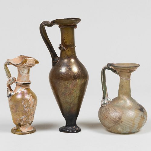 GROUP OF THREE ROMAN GLASS JUGS