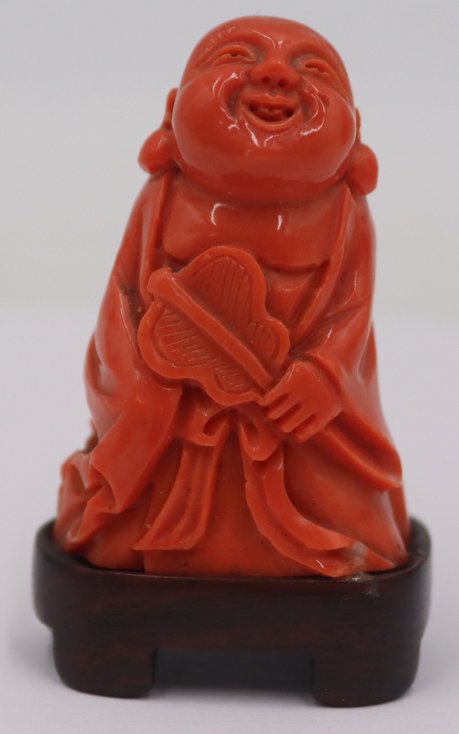 CARVED SALMON CORAL OF A BUDDHA 3bbea9