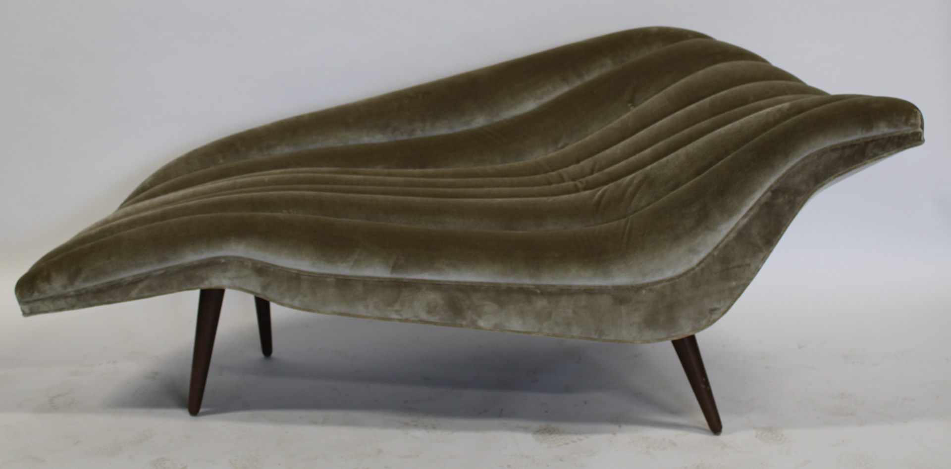 AFTER HANS HARTL UPHOLSTERED CHAISE.