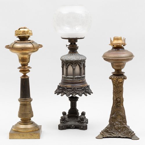 GROUP OF THREE METAL OIL LAMPSTwo