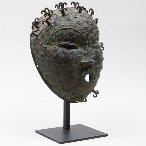 ETHNOGRAPHIC METAL MASKOn stand 17 3bc0c5