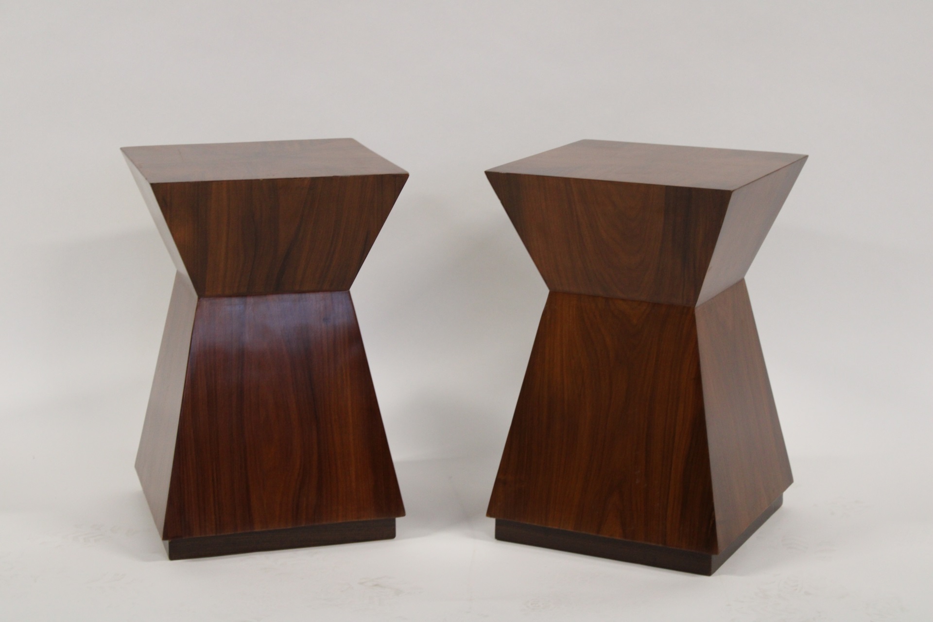 A VINTAGE PAIR OF SHAPED STANDS