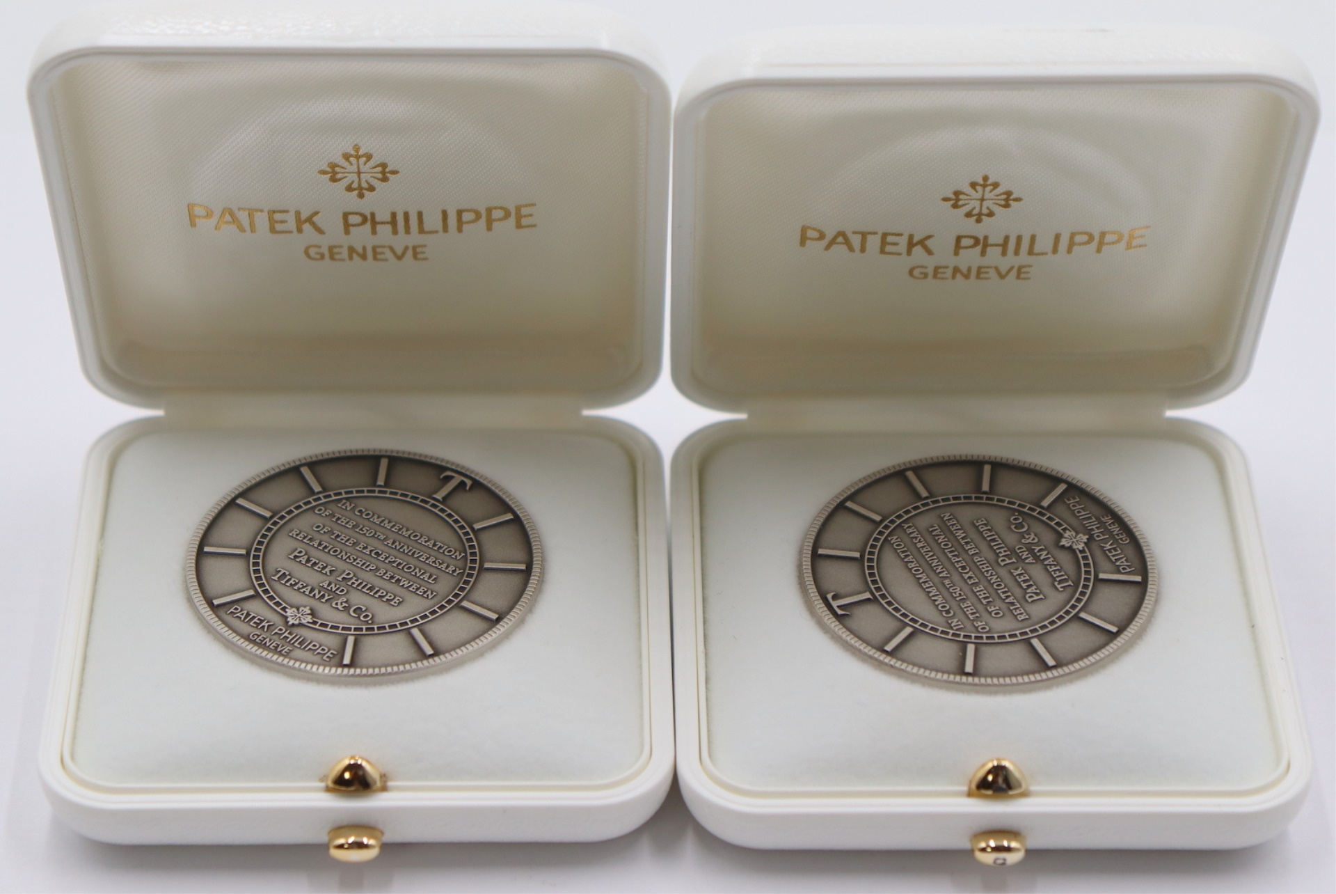 EXONUMIA. (2) PATEK PHILIPPE TIFFANY