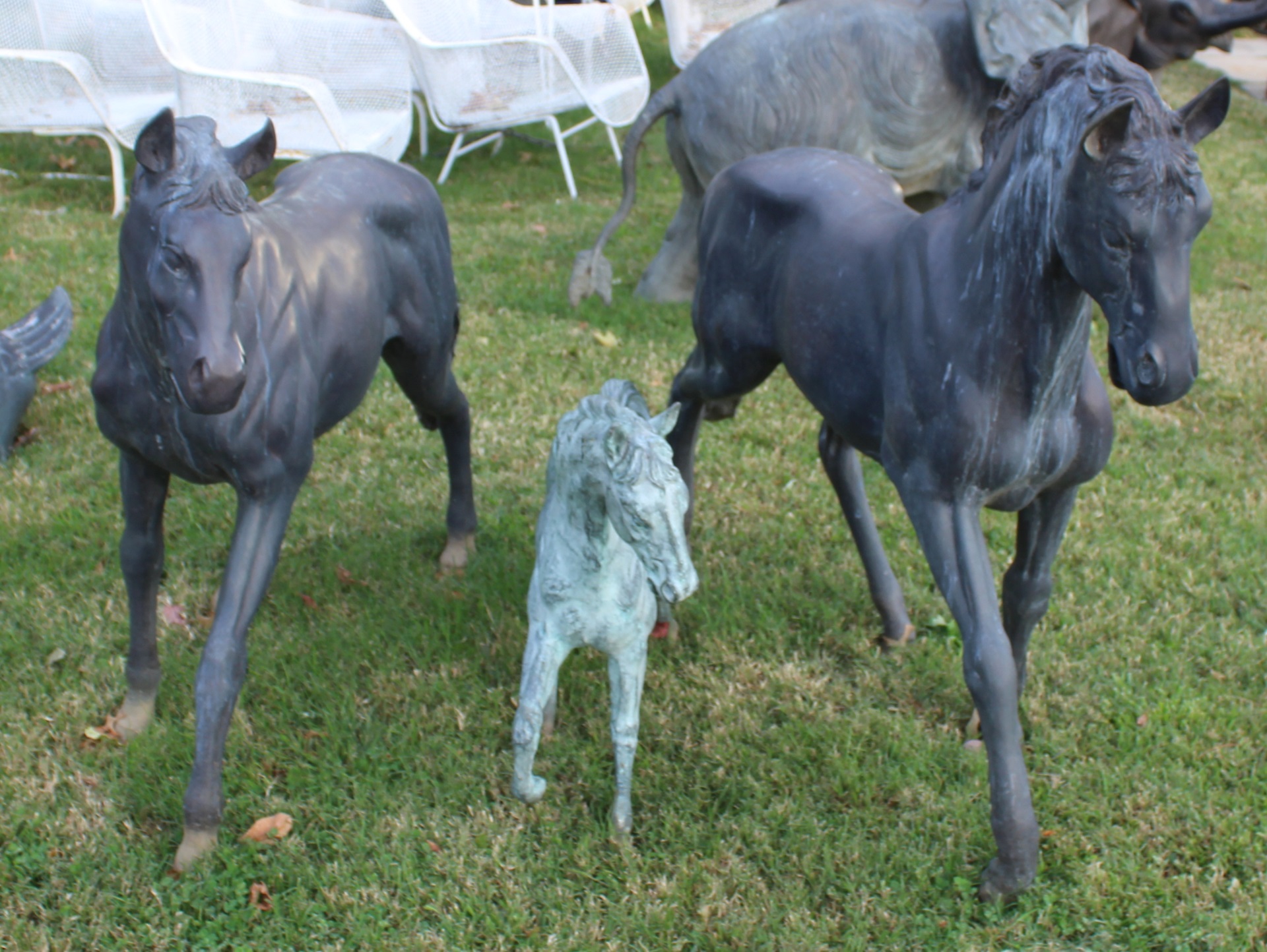 3 PATINATED METAL HORSE SCULPTURES.