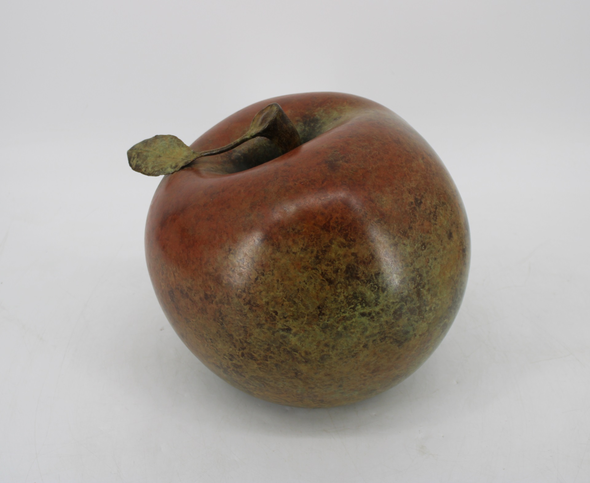 A LARGE PATINATED BRONZE APPLE