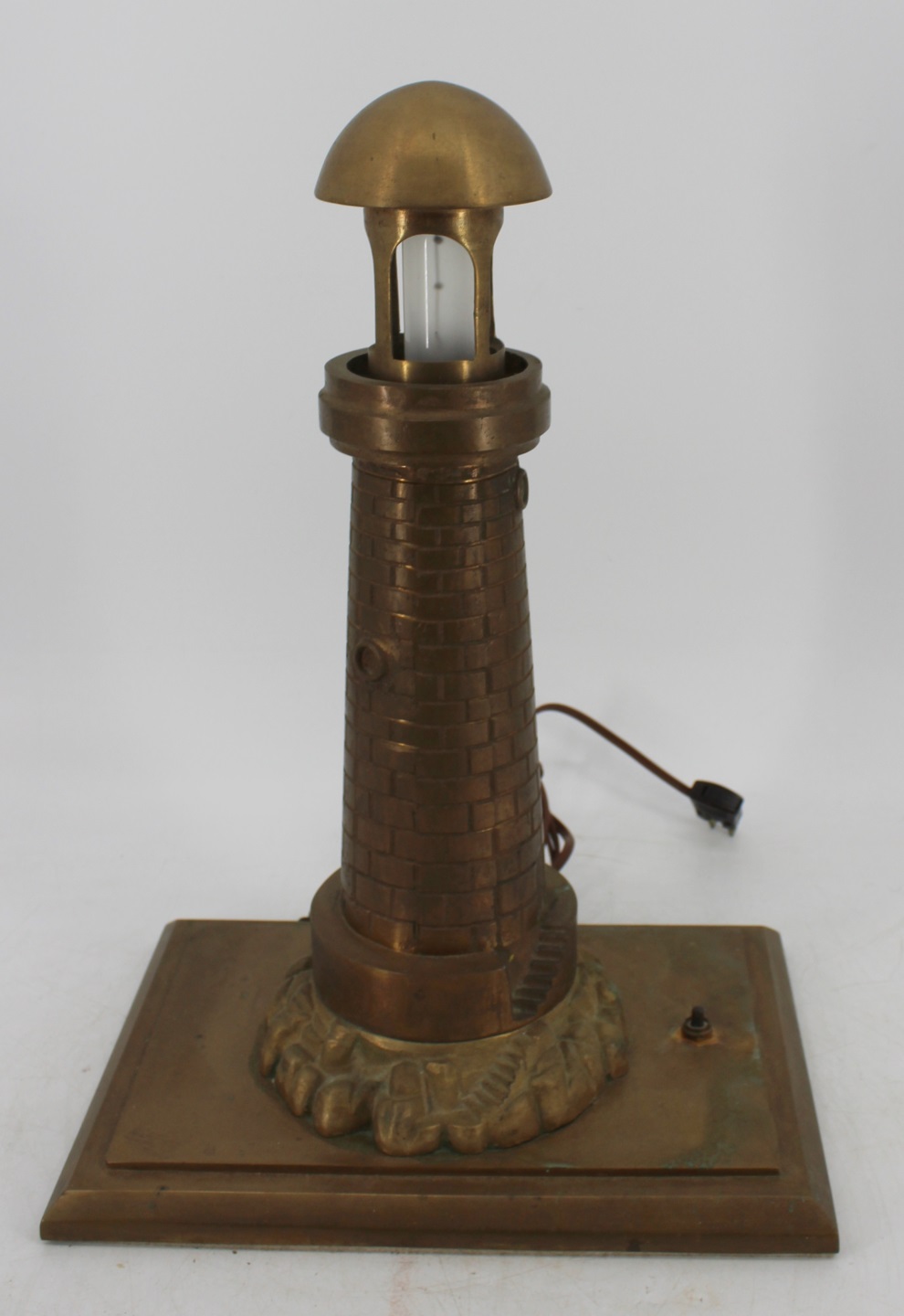 A LARGE BRASS MACHINED LIGHTHOUSE 3bc687