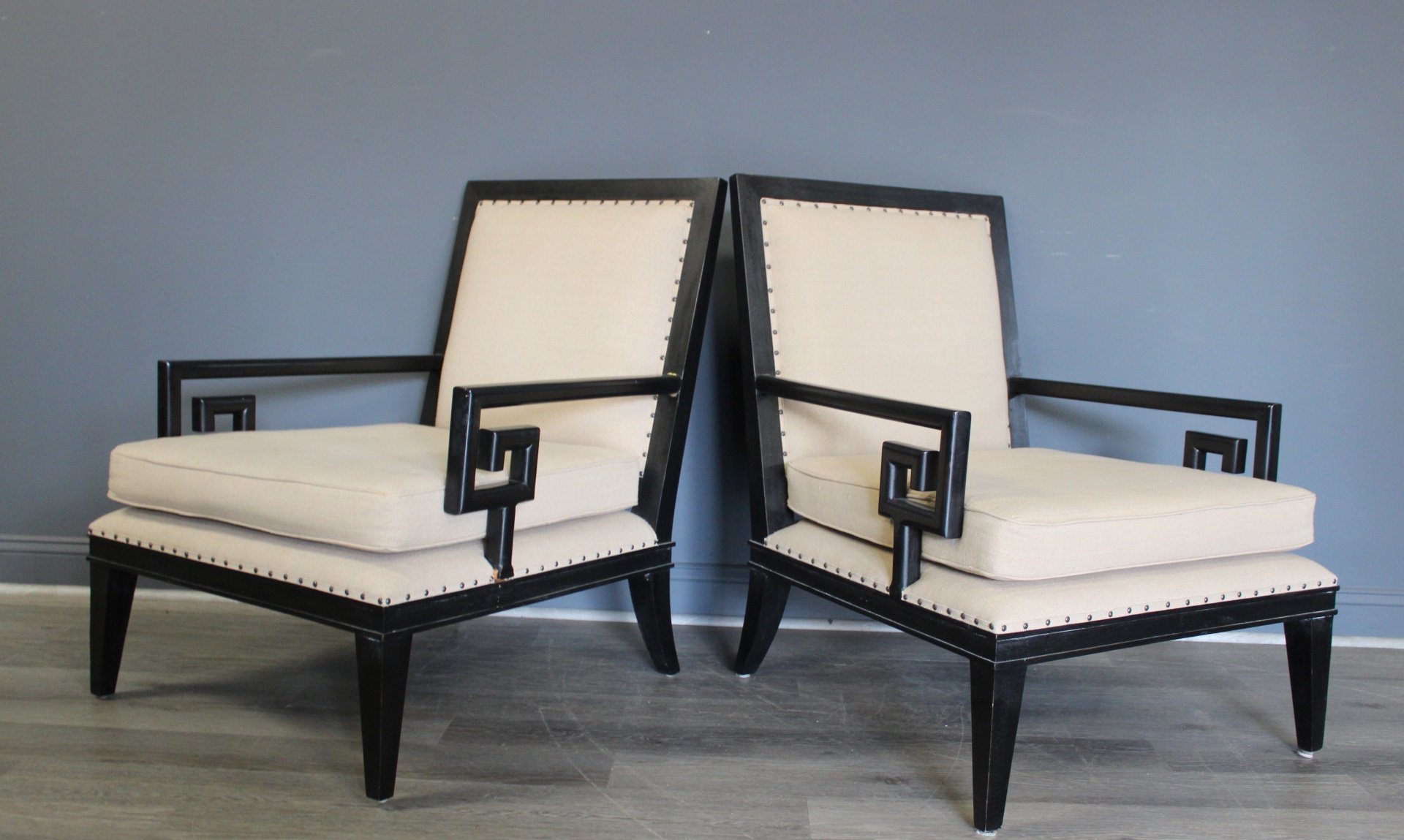 A VINTAGE PAIR OF EBONISED CHAIRS WITH